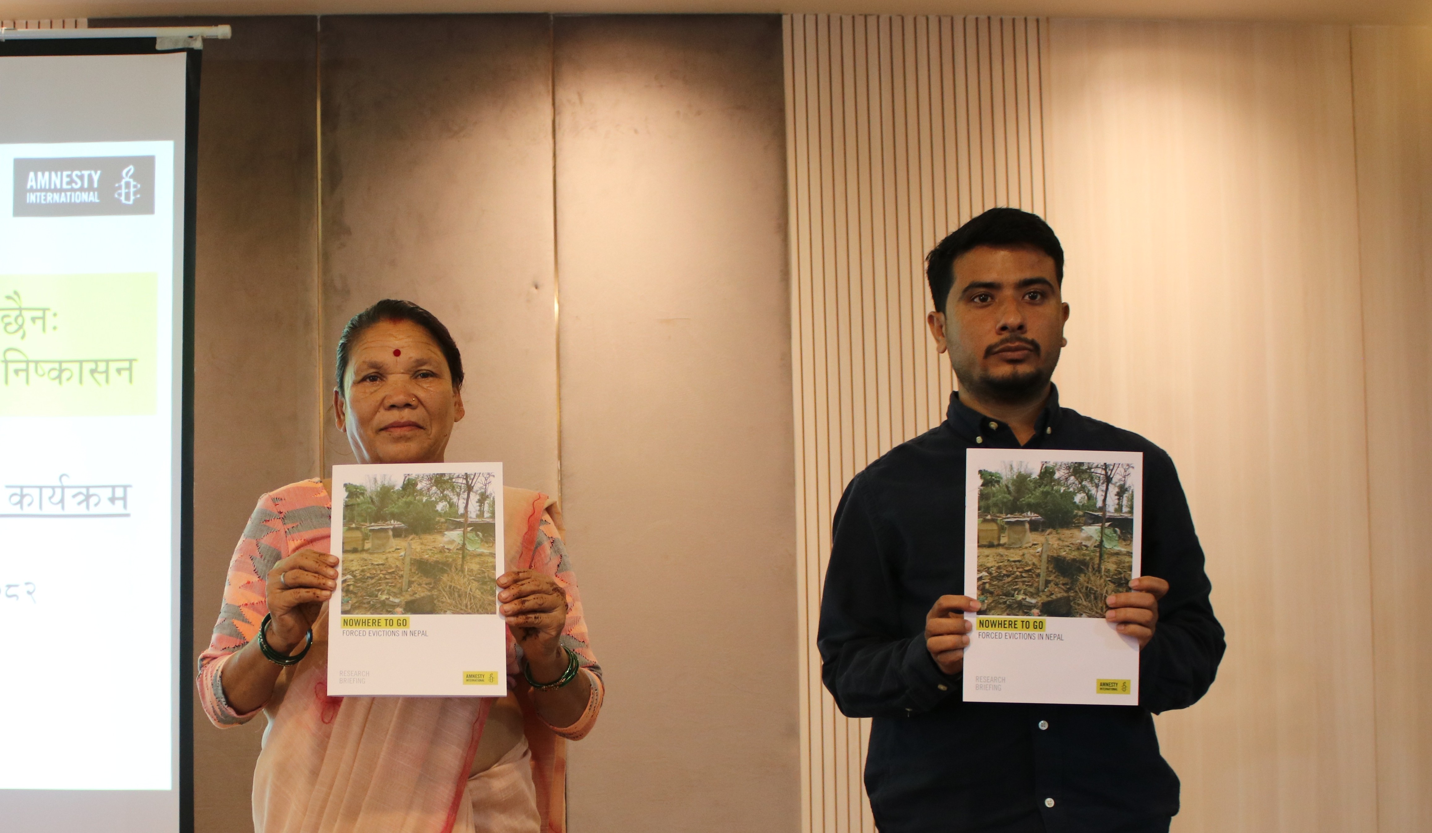 (Right) Amnesty Nepal’s Chairperson Bipin Budhathoki and Januka Pokherel, a resident of the Thapathali informal settlement in Kathmandu, jointly unveil the report.