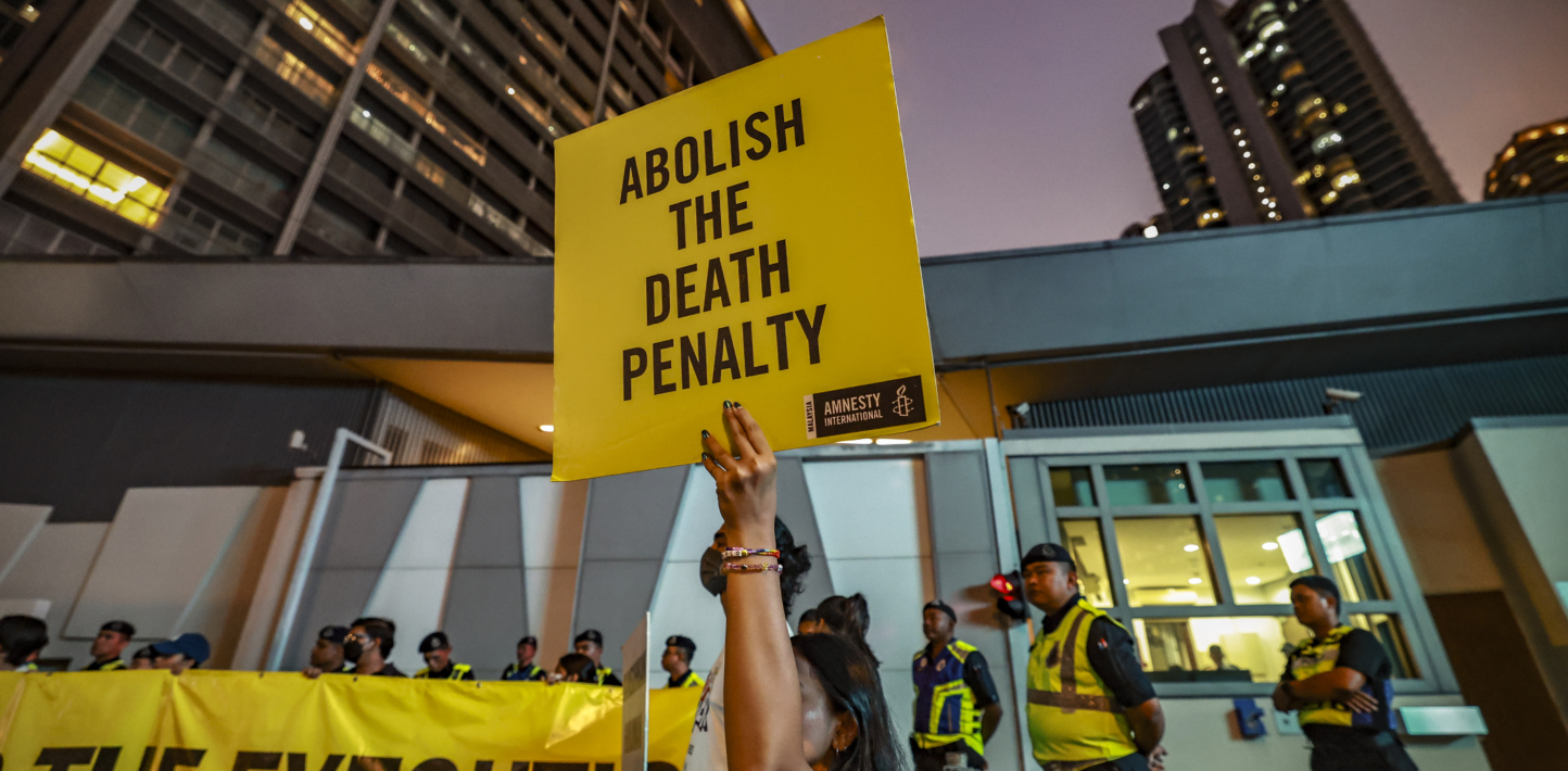 Amnesty International activists hold a banner outside Singapore's embassy in Kuala Lumpur, Malaysia, on May 6, 2025. (Photo by Hari Anggara/NurPhoto via Getty Images)