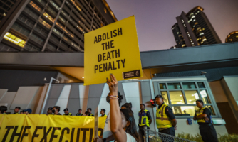 Amnesty International activists hold a banner outside Singapore's embassy in Kuala Lumpur, Malaysia, on May 6, 2025. (Photo by Hari Anggara/NurPhoto via Getty Images)