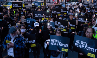 LONDON, UNITED KINGDOM - 2023/06/04: Participants are seen holding posters and candles during the vigil. A candle-lit vigil organised by the Amnesty International took place outside the Chinese Embassy in London as a tradition in memorial of the people who died in the 1989 Tiananmen Massacre. (Photo by Hesther Ng/SOPA Images/LightRocket via Getty Images)